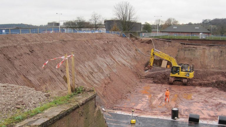 ASP steep batter construction and installation of drainage membrane - Courtesy of OGI Groundwater Specialists Ltd
