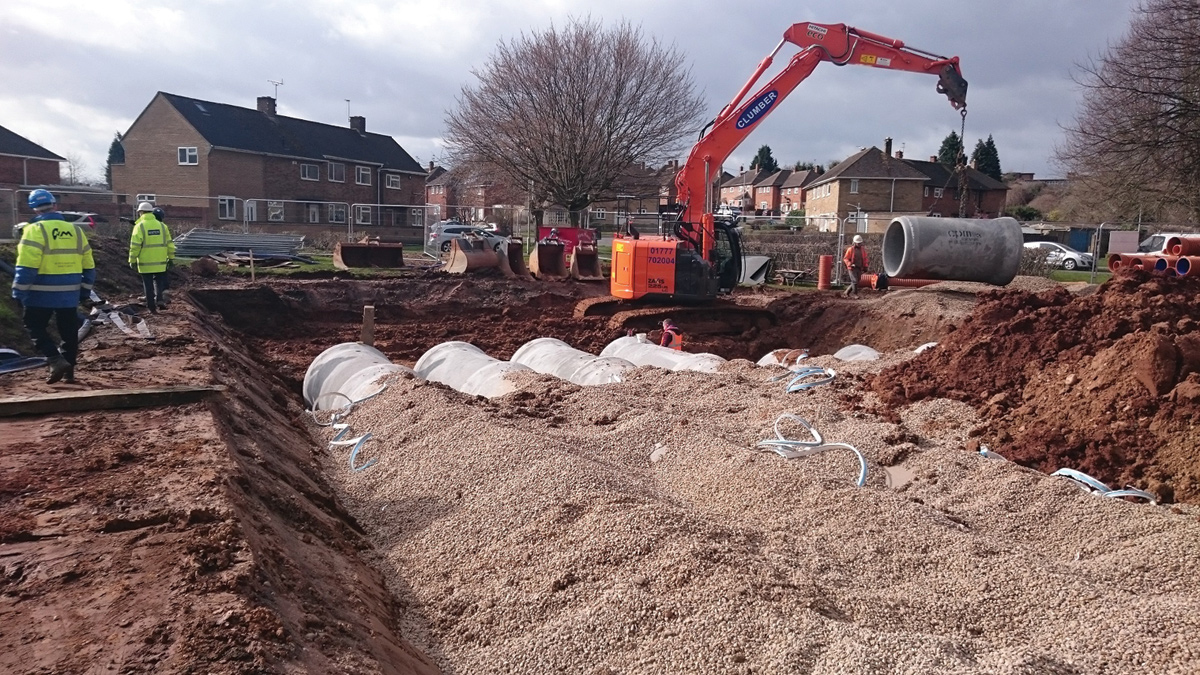 Battered excavation with concrete pipes partially backfilled with gravel - Courtesy of NMCNomenca