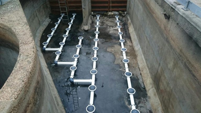 Figure 3 - Installation of new diffuser pipework inside drained down inlet channel - Courtesy of MWH Treatment