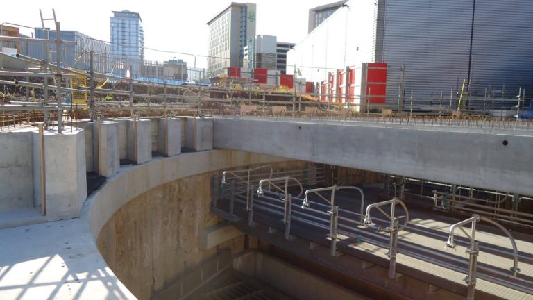 Installation of precast roof beams - Courtesy of GCA JV