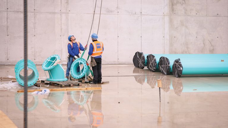 Installing Scotchkoted 500mm pipework inside the reservoir - Courtesy of Stonbury