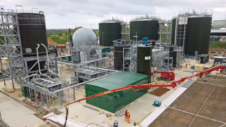 Road construction underway. Dewatering belts and polymer dosing kiosk in the foreground - Courtesy of Costain