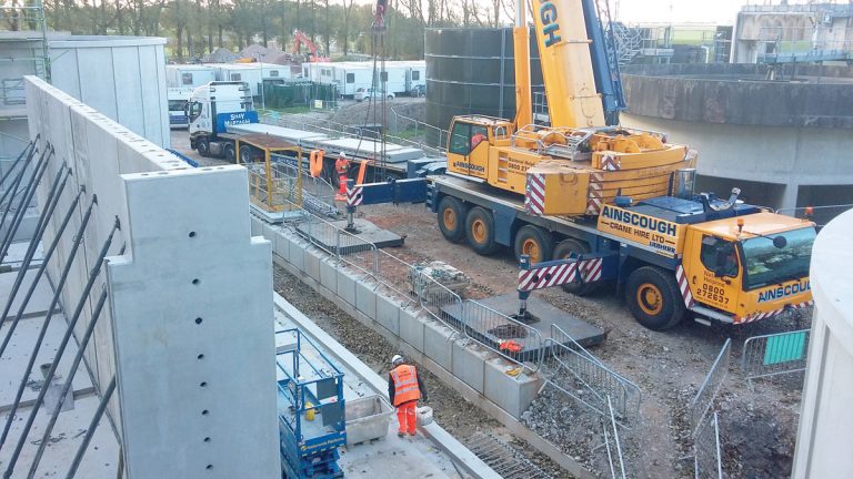 Erection of precast wall units ASP walls and - Courtesy of C2V+