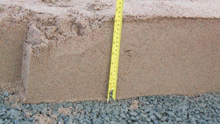 Filter material overlying drainage material (itself overlying filter material) within the part-face filter blanket. Formwork was used to ensure the correct layer thickness throughout - Courtesy of MMB