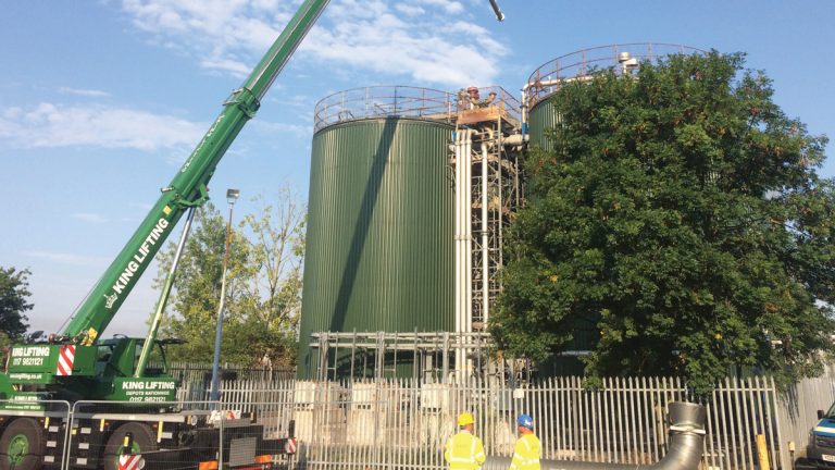 Lifting the gas draw-off pipe off the roof - Courtesy of WECS