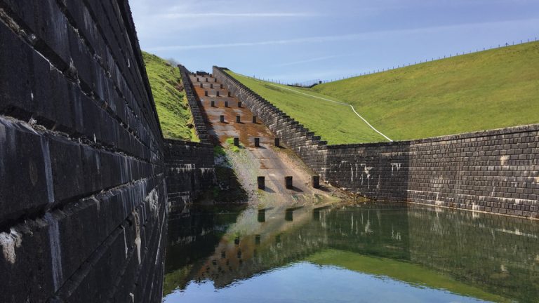 View looking up existing spillway from stilling basin Courtesy of Skanska UK
