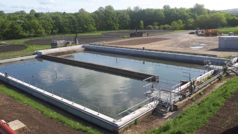 Storm tanks in operation, with raised outlet weir and peripheral walls - courtesy of MMB