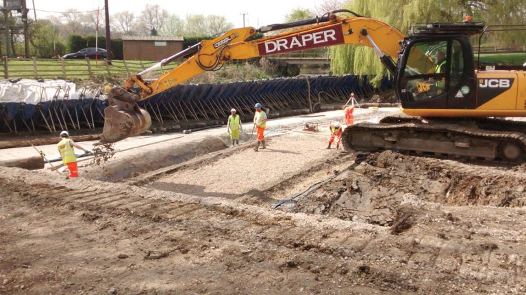 Working behind the dam - Courtesy of NMCNomenca