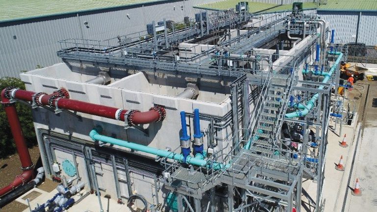 Aerial view of the 3 (No.) Nereda reactors and sludge buffer which consolidate the waste sludge, together with the treated water discharge pipe - Courtesy of Thames Water