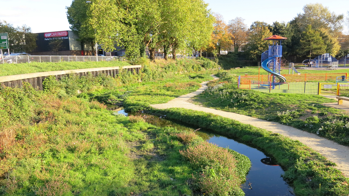 Figure 4: Manor Road Park after construction of river improvement works. The river is now reconnected to the groundwater and flood plain in a new meandering channel with riffles and pools creating multiple habitats for macrophytes, macroinvertebrates and fish - October 2018 - Courtesy of Affinity Water