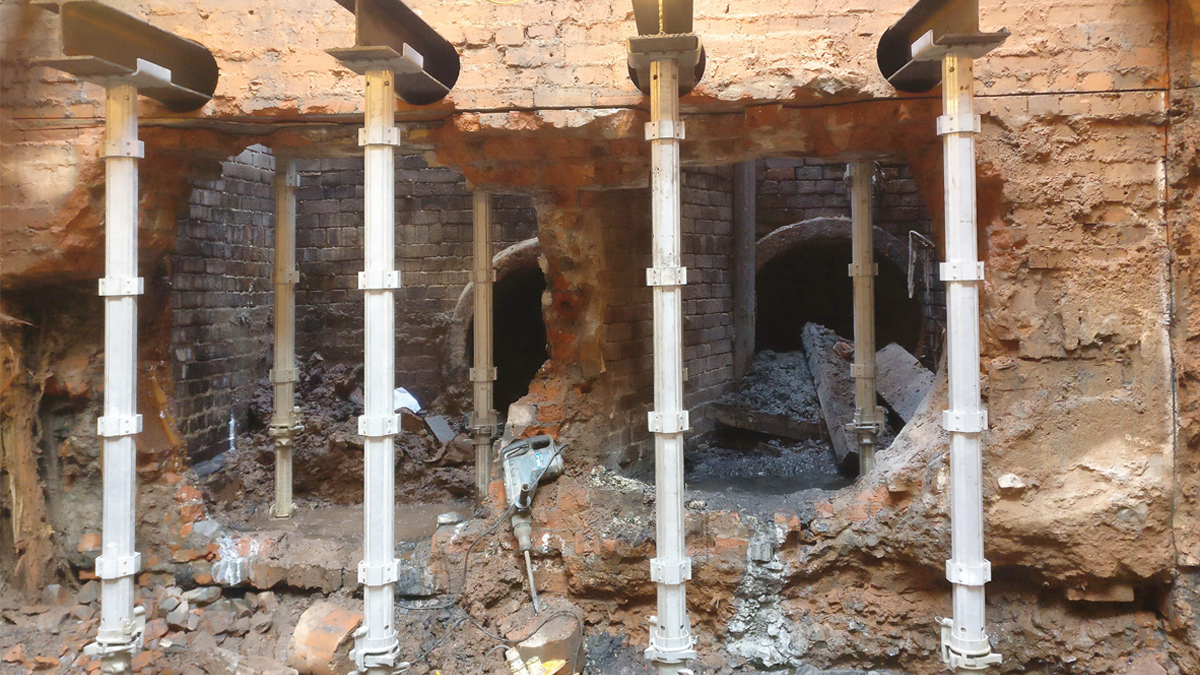 Installation of temporary props to support brickwork prior to installation of steel frame temporary works - Courtesy of Dawson WAM