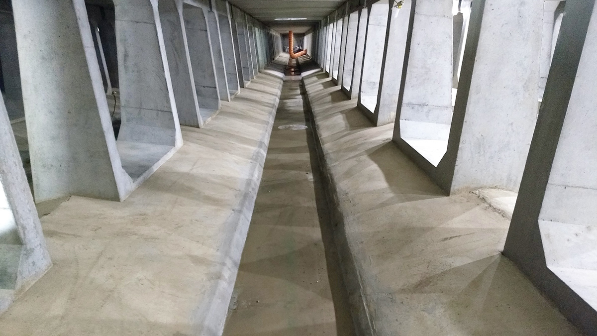 Lane within the tank showing self cleansing benching - Courtesy of NWG & Wood PLC