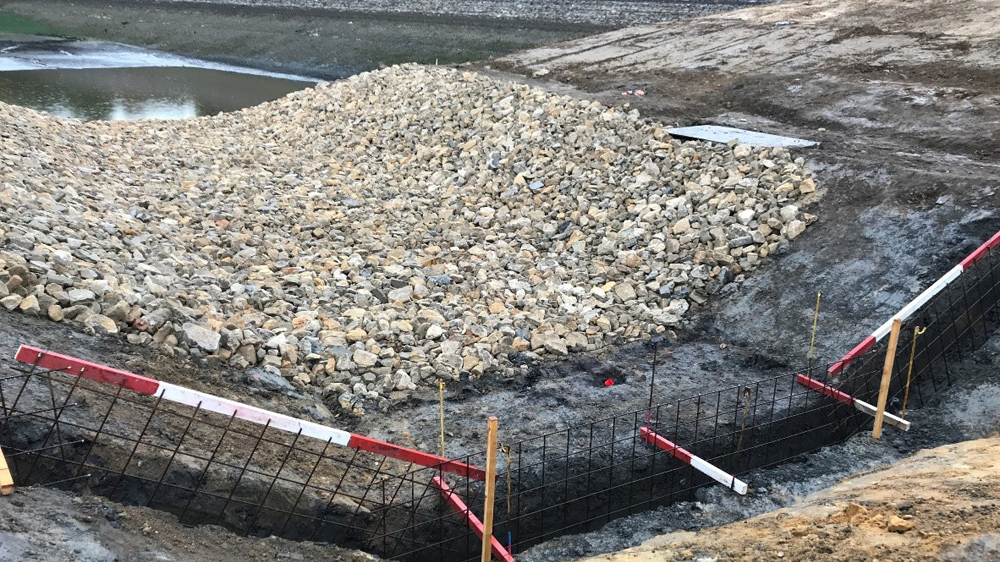 Weir cut off into the clay core - Courtesy of MMB