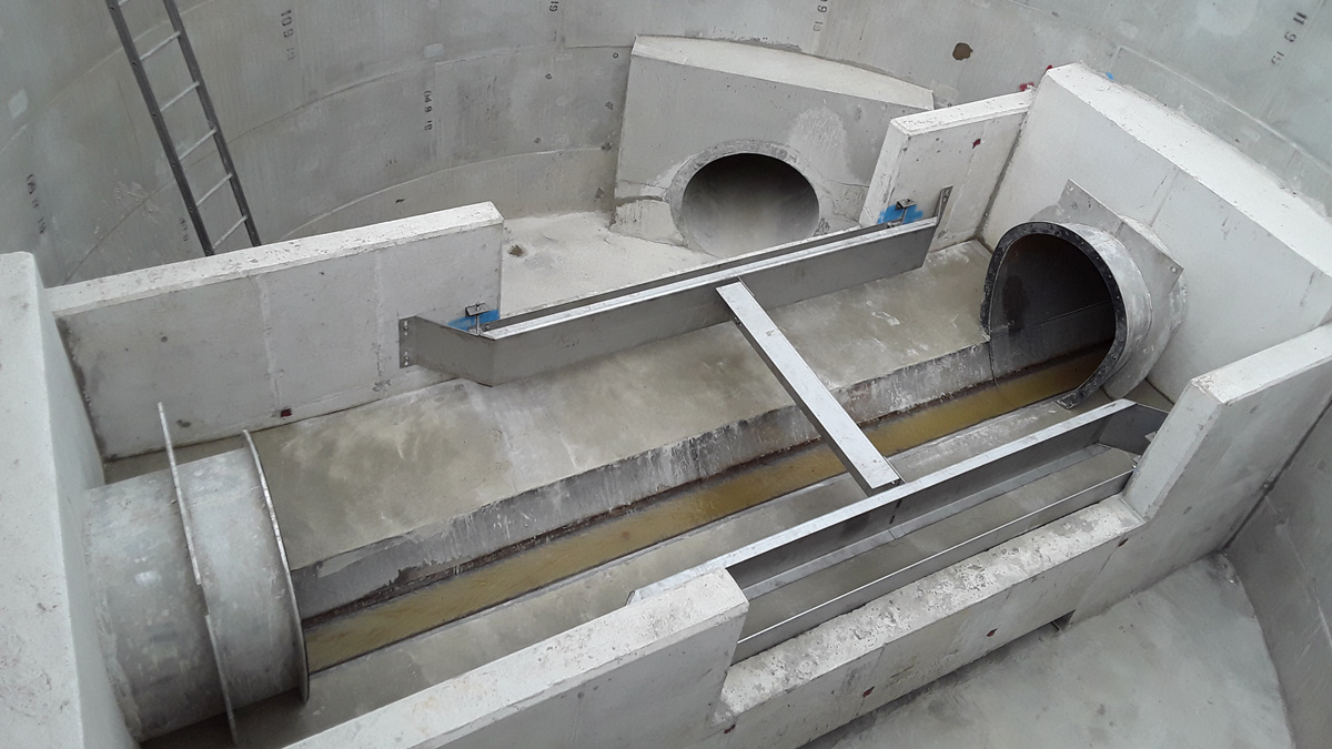 Finished weir chamber, complete with reinforced portals, weir walls and stainless steel baffle plates/scum boards - Courtesy of nmcn PLC