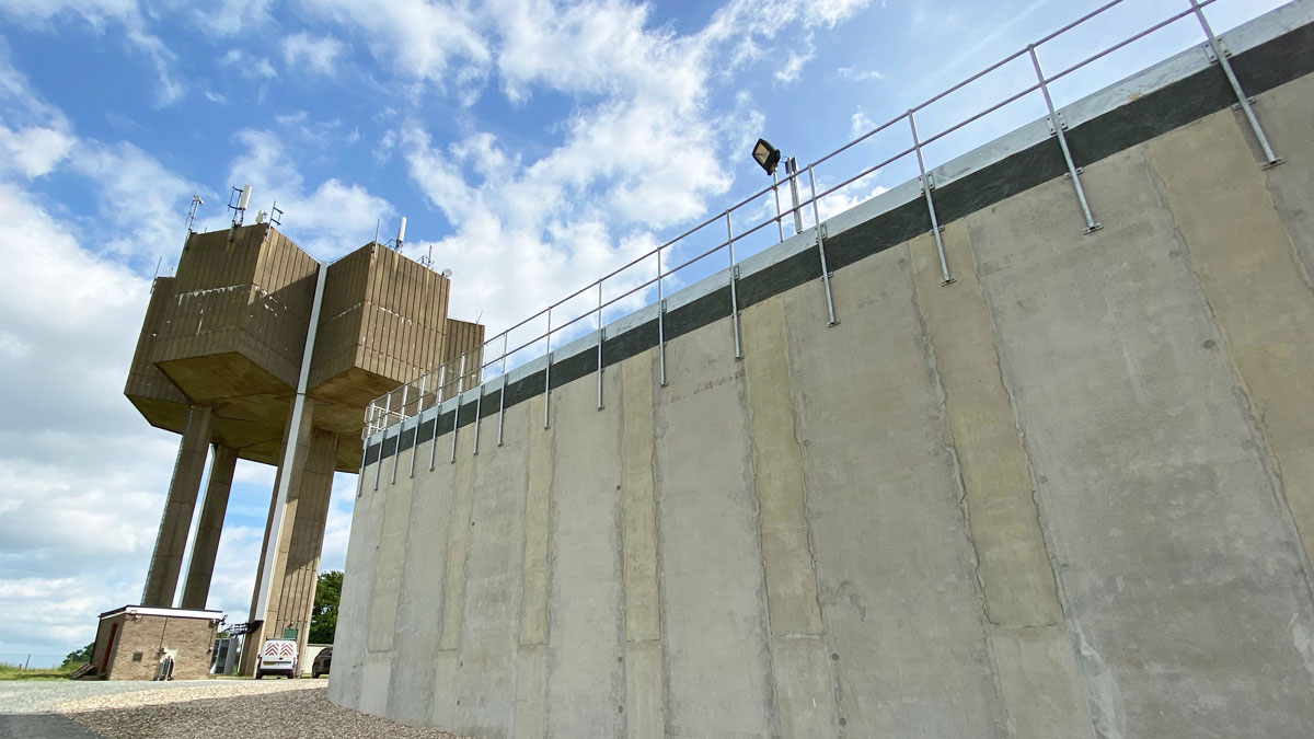 The completed Horstead Storage Reservoir with the original water tower - Courtesy of @one Alliance