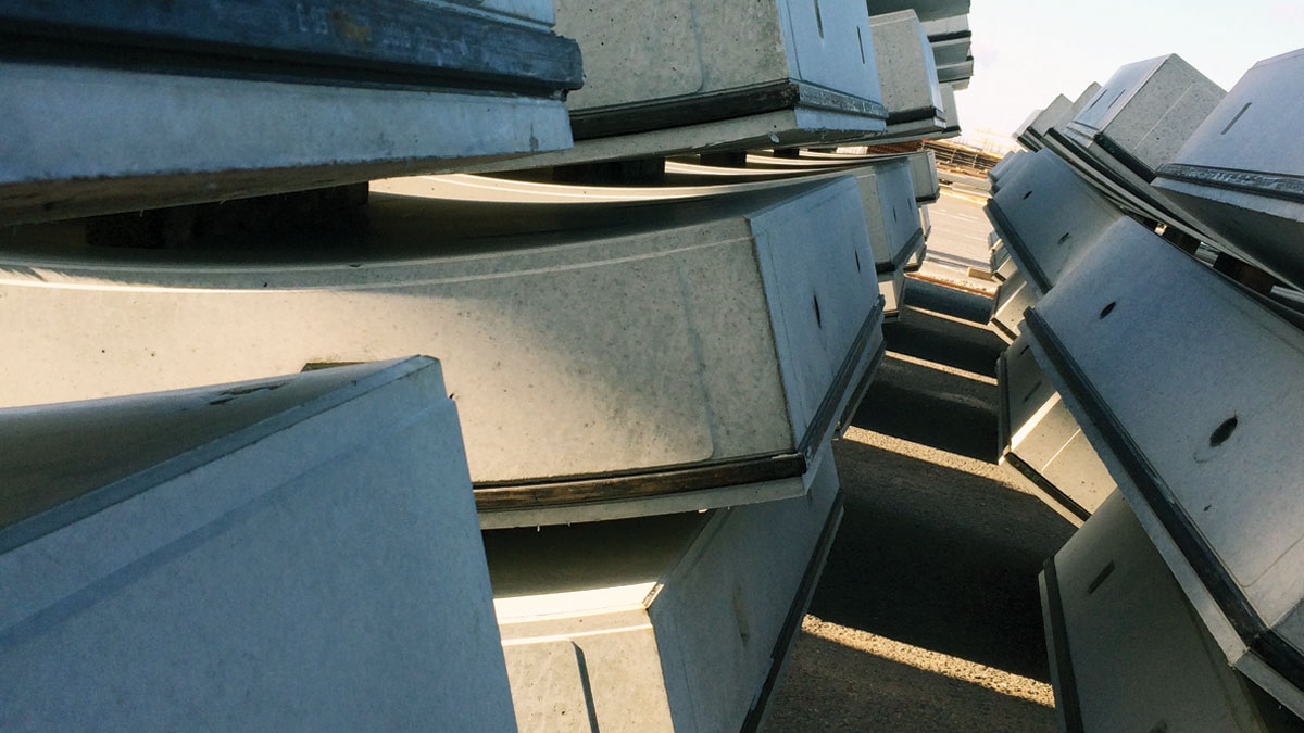 Precast concrete segments stockpiled in courtyard - Courtesy of AECOM