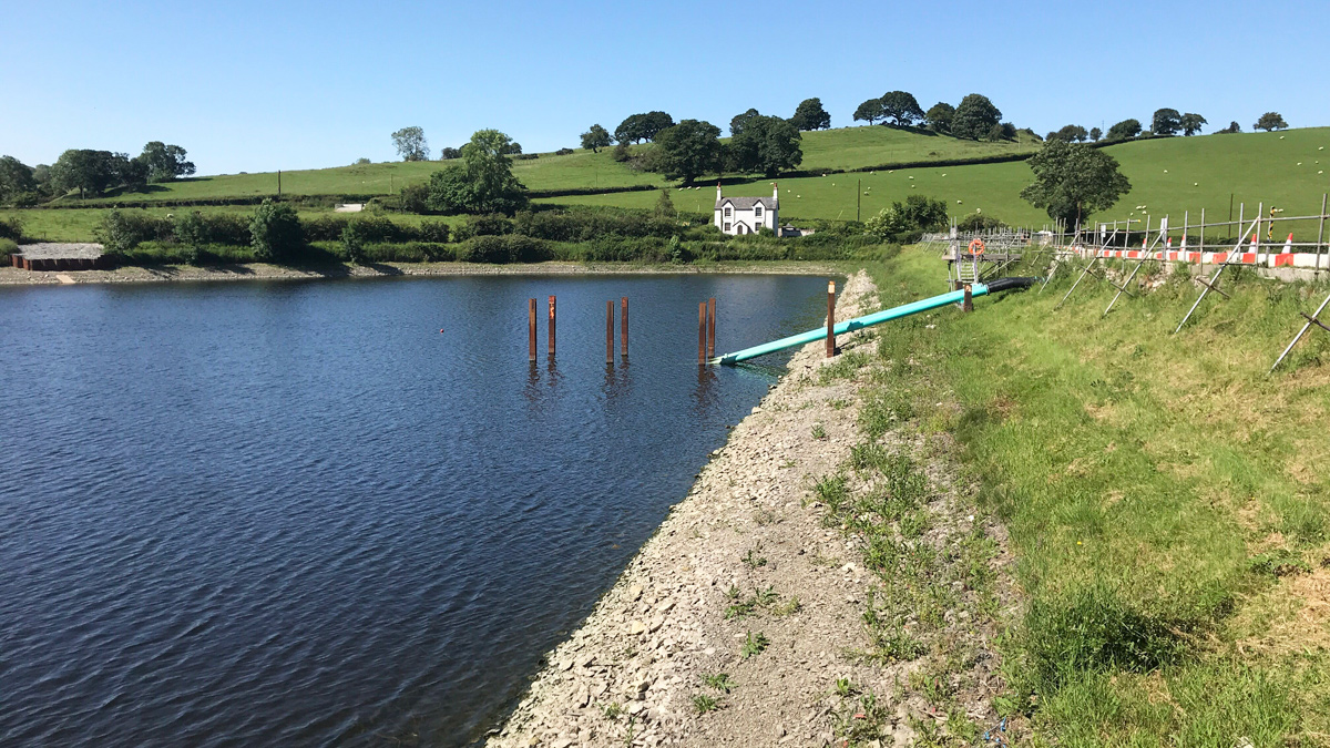 Siphons installed on the face of the dam and through the dam - Courtesy of Skanska