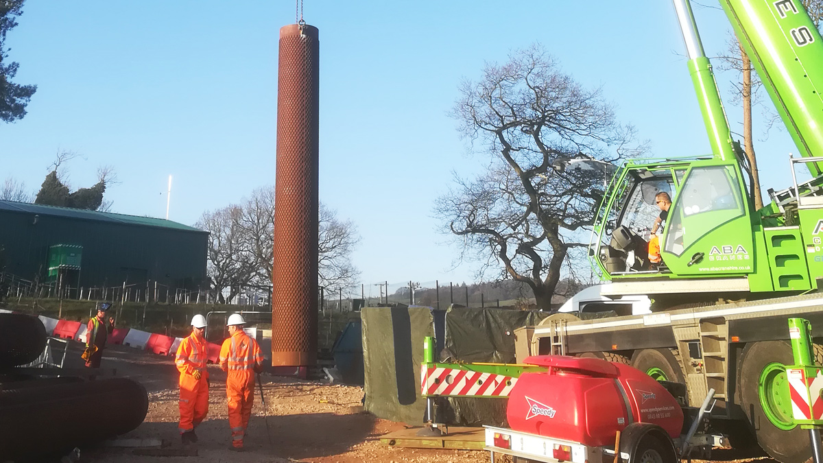 Slotted casing being lifted into place in BH3 - Courtesy of MMB