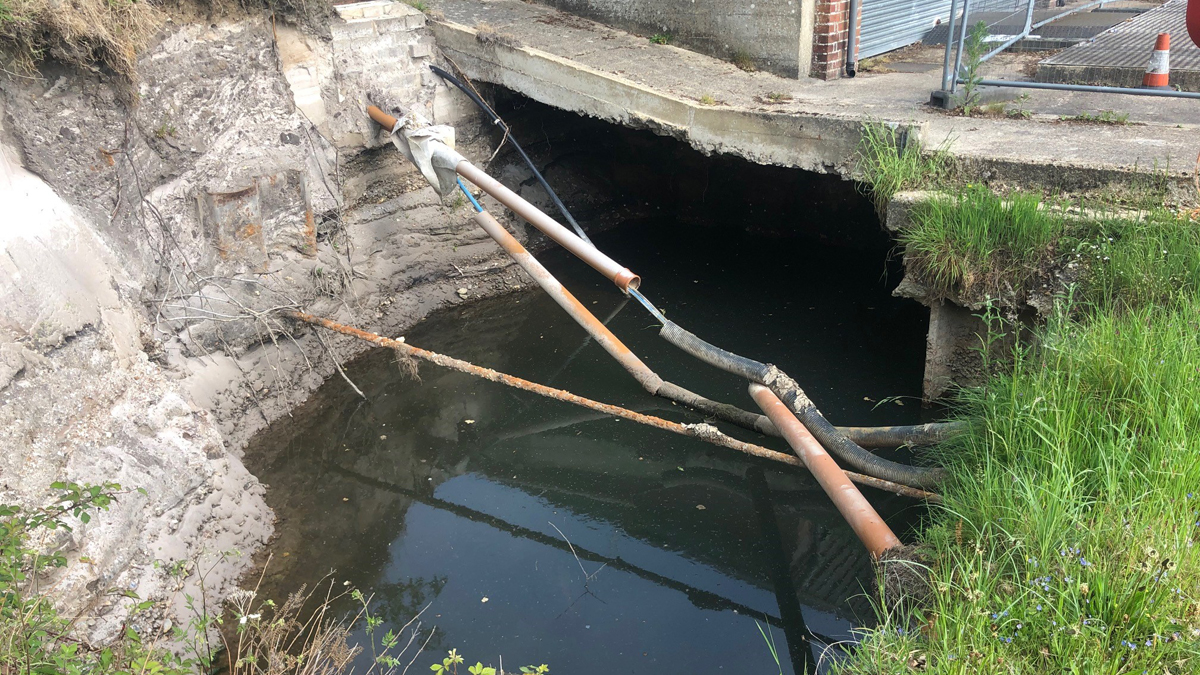 Riverbank washout adjacent to intake prior to commencement of works Courtesy of Teignmouth Maritime Services/Bournemouth Water
