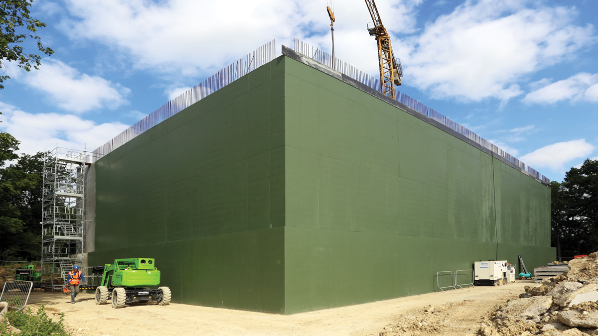View of tank under construction with newly painted exterior walls - Courtesy of Stonbury