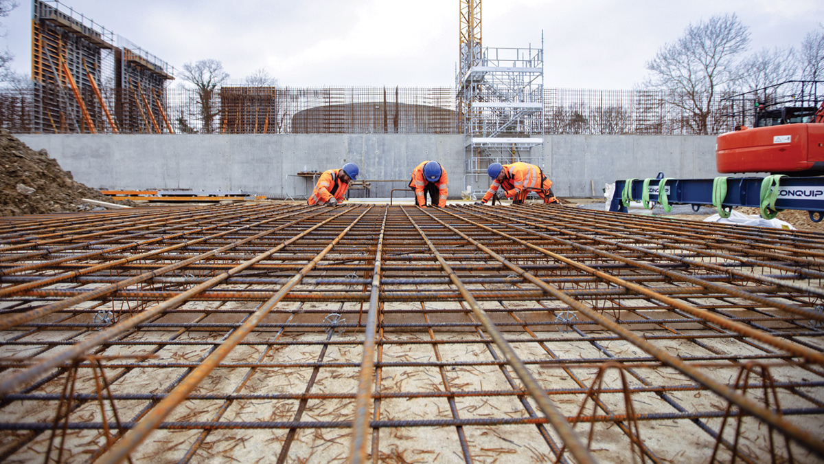 Construction workers building reinforcement cage for walls - Courtesy of Stonbury
